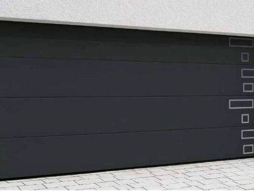 Porte de garage latérale anthracite AFC aux inserts métal design, façade blanche Calvados.